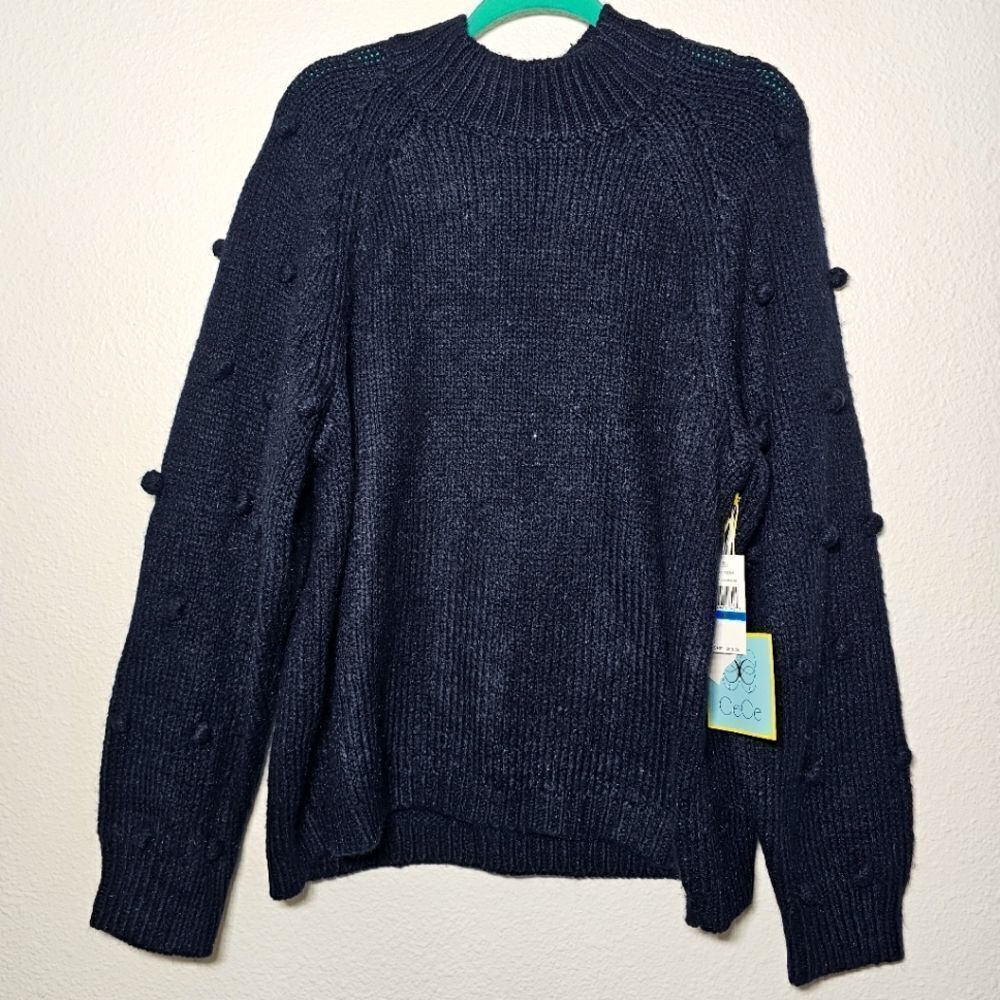 Cece NWT XL black oversized knitted sweater with pom poms on the sleeves